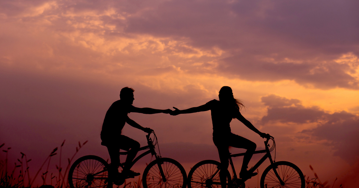 a man and woman are riding bicycle.