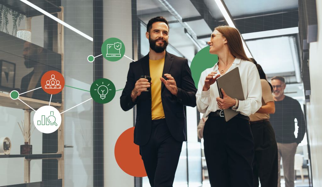 a man and a woman walking in the office